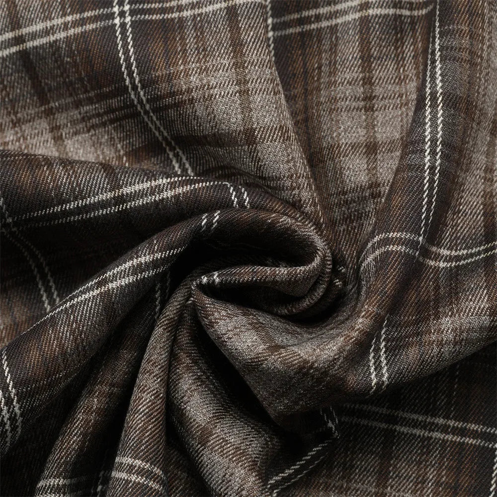 Men's black and brown plaid short sleeve shirt with embroidered lettering and lapel collar.