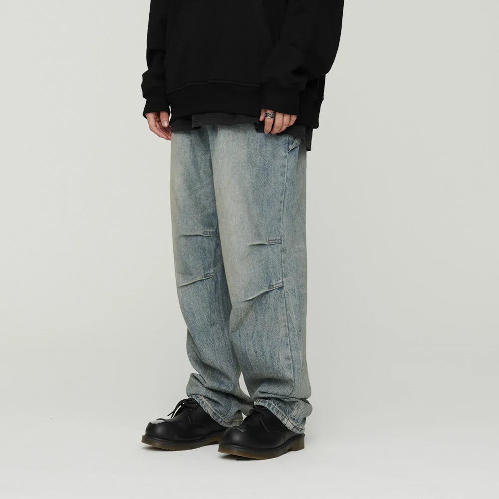 Light wash grey baggy oversized denim jeans with pleats, straight leg, 100% cotton, distressed washed blue