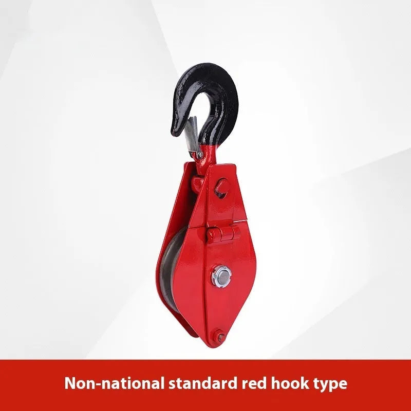 Red steel industrial lifting pulley with a safety latch and large hook opening.