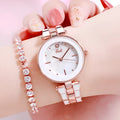 Ladies quartz watch with white dial, rose gold tone, 30mm round alloy case, and steel strap