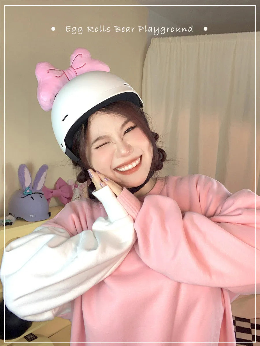 Plush bow helmet decoration in red, pink, and rose pink colours for motorcycle and ski helmets