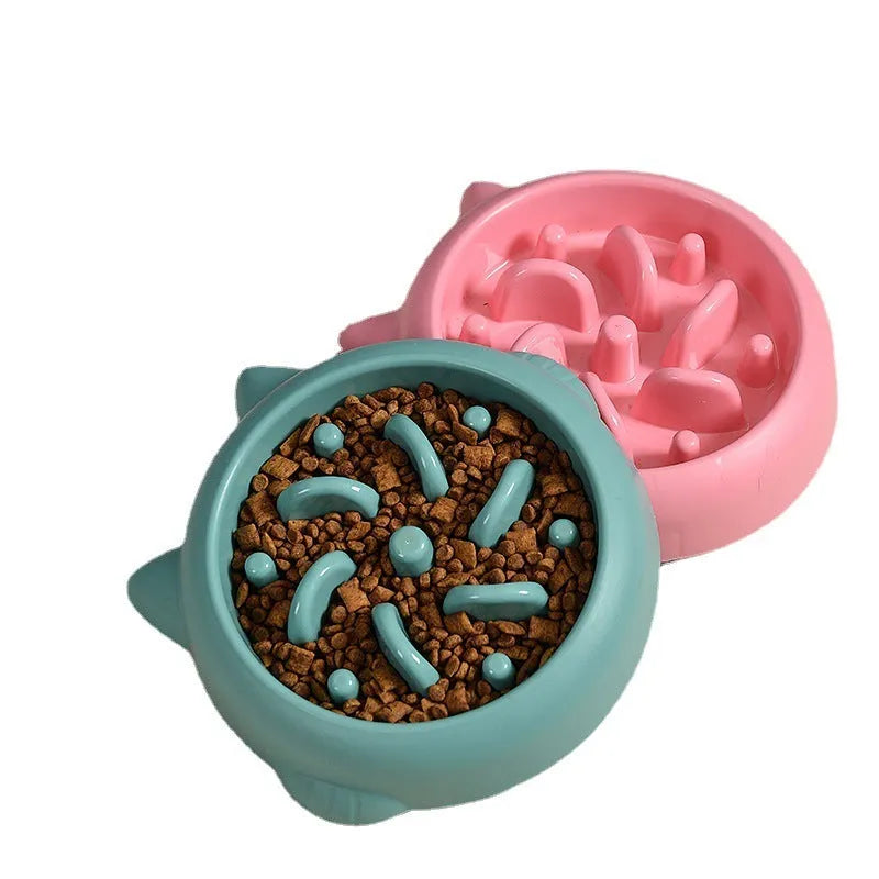 Green bone-ridge slow feeder bowl for dogs and cats on a floor.