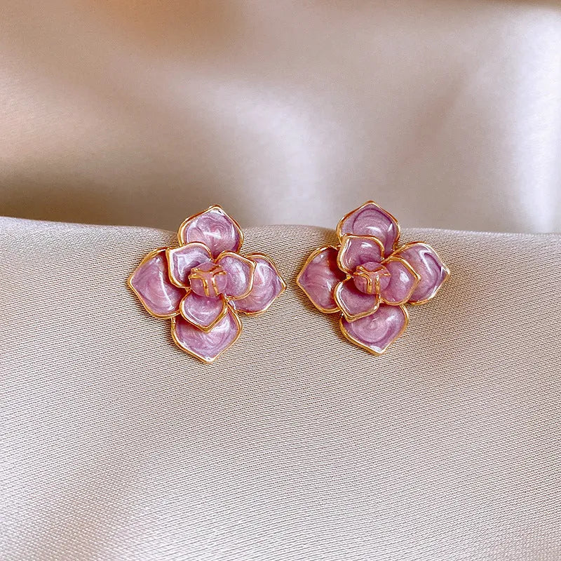 Purple and gold flower stud earrings with oil-spot glaze finish on copper bases