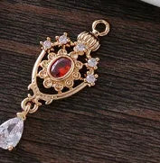 Small hollow water drop pendant with zircon accents in one of five colours.
