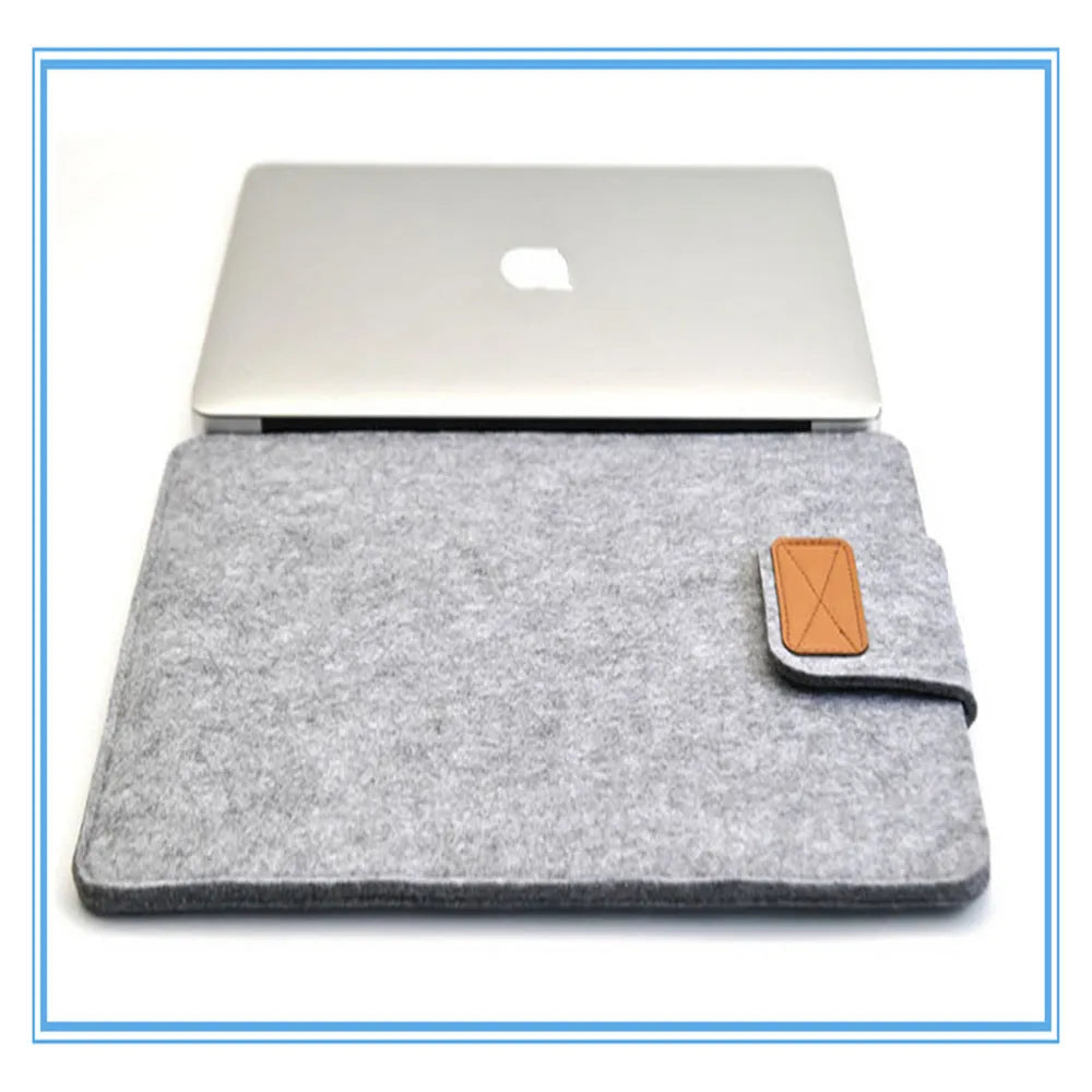 Dark grey felt plush clamshell laptop bag showing interior with corner protector and computer compartment