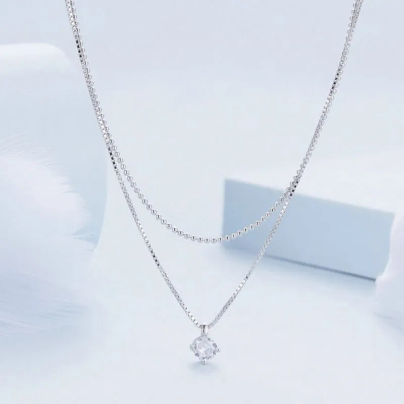 Sterling silver necklace with double-layer pendant and pearl chain style