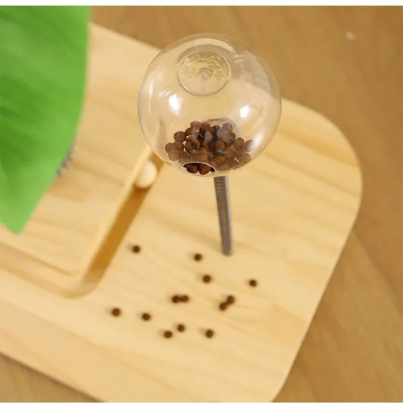 Wooden vertical cat scratching post with canna-coloured centre column and a built-in food drop ball.