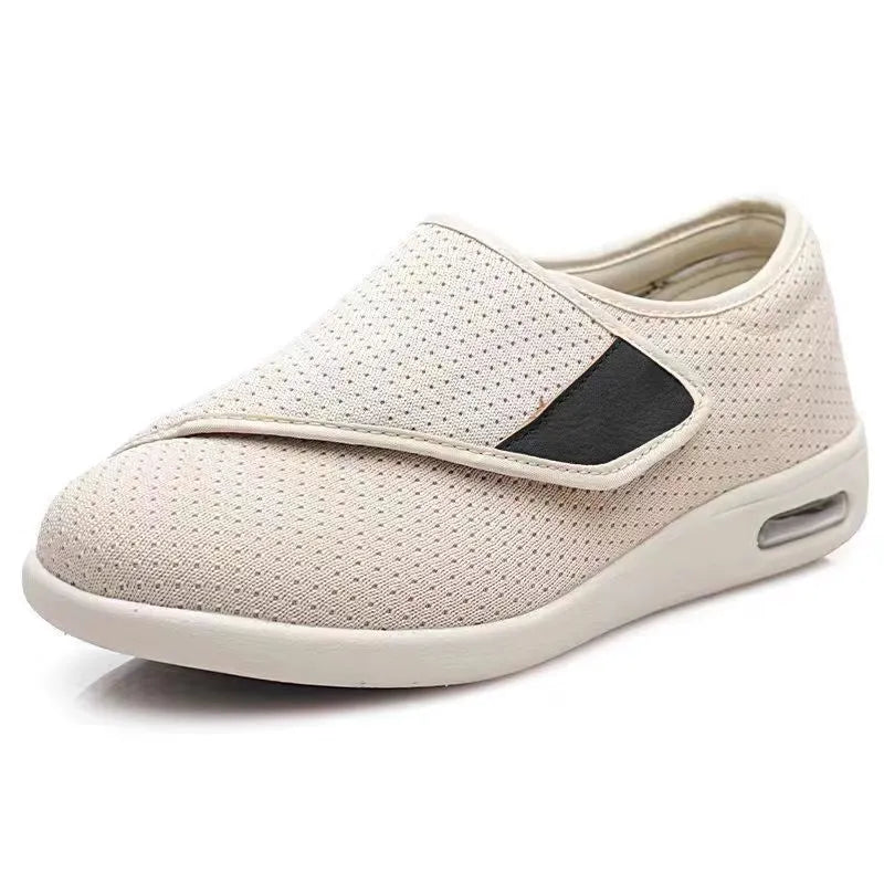 Beige leisure shoes with velcro strap closure and a round toe on a foam rubber sole.