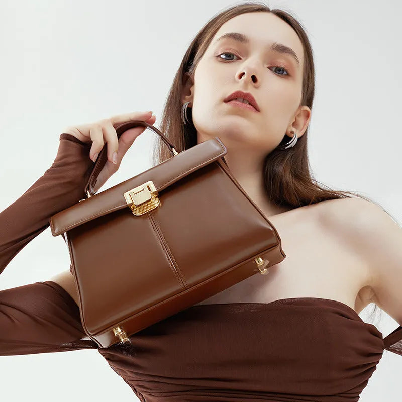 Women's black genuine leather shoulder bag with horizontal square shape and cover opening