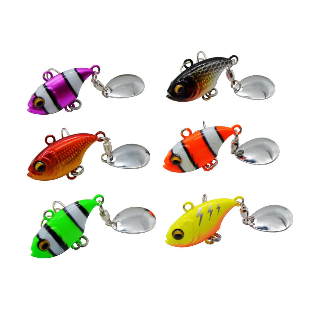 Metal plate fishing lure with rotating sequins shown in multiple colour options including zebra stripes and solid gold.