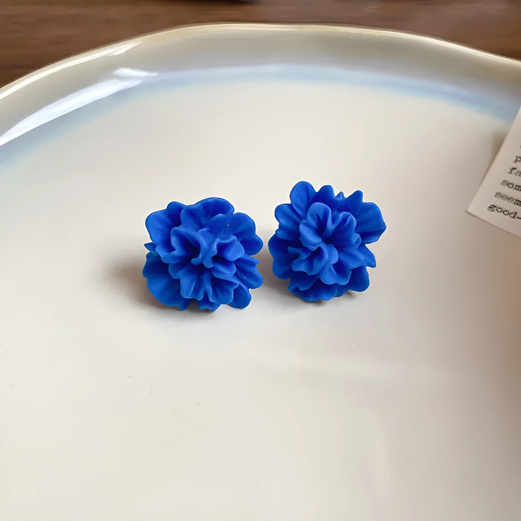 Women's handmade geometric cloth earrings with blue resin flower colour detail
