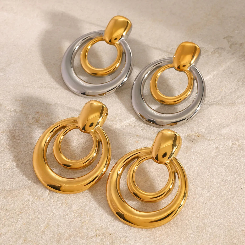 Gold round geometric stud earrings with double layer hollow construction and 18K gold electroplated finish