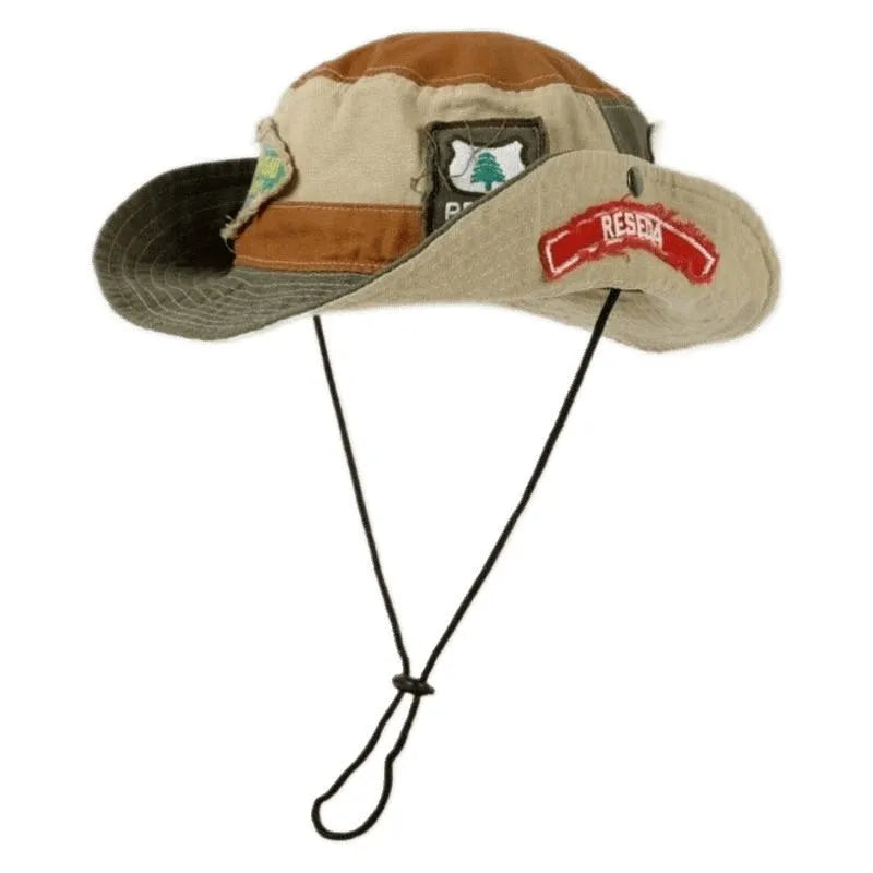 Army green foldable cotton fisherman hat with hand-painted patchwork design and flat top crown.
