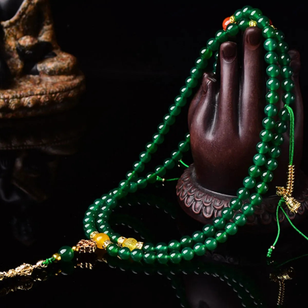 Close-up of a multi-circle green agate bracelet for men and women on a wrist.