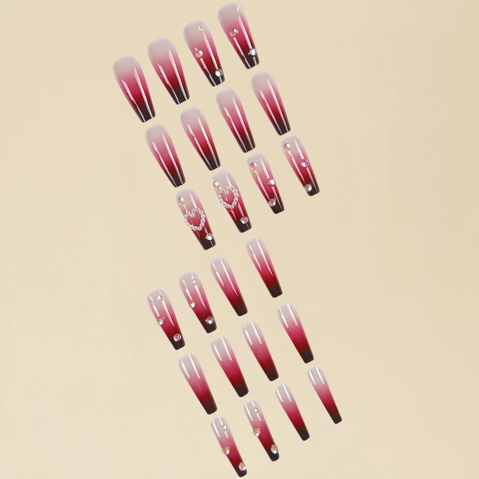 Wine red gradient false nail tips with plaid pattern and pearl heart accents in a long ballet shape.
