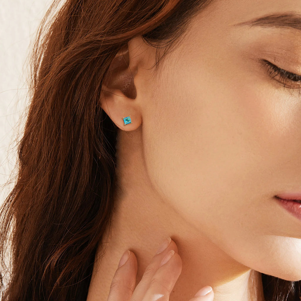 Gold-plated pear drop earrings in a candy colour with zircon stone accents on a simple copper setting.