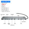 Grey aluminium alloy laptop docking station cooling bracket with ten-port connectivity hub.