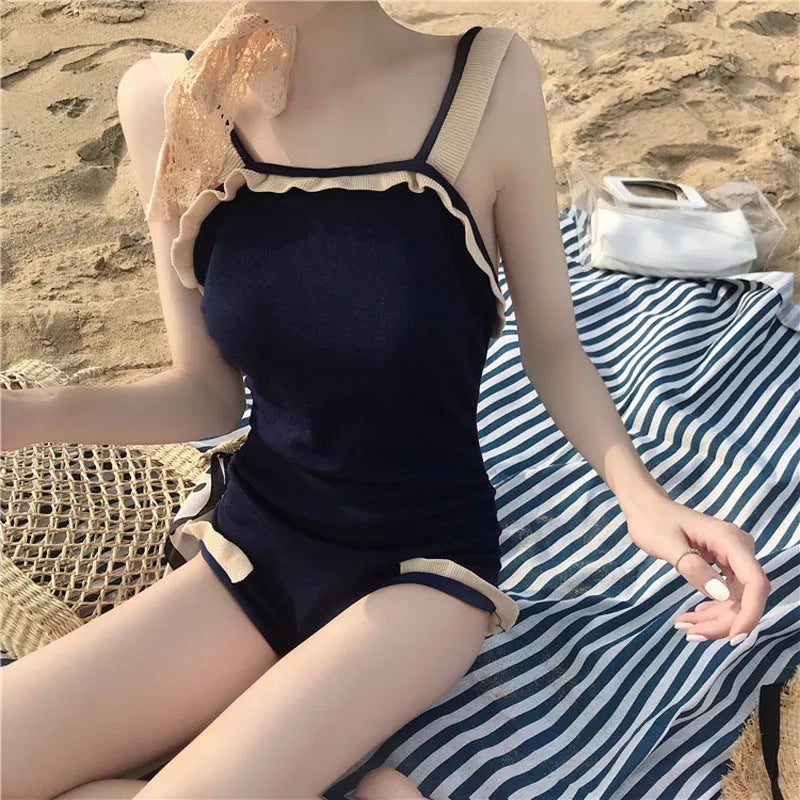Conservative one-piece swimsuit for women in nylon fabric with modest coverage and traditional styling