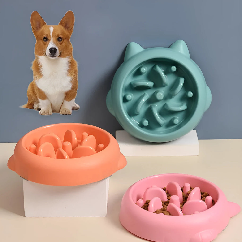 Green bone-ridge slow feeder bowl for dogs and cats on a floor.