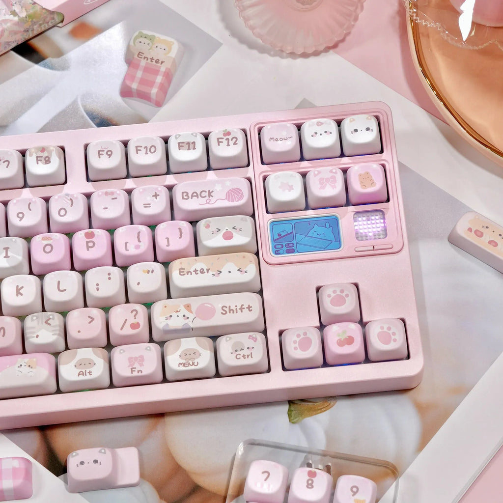 MOA height pink sublimation keyboard keycap set with cartoon design, shown on a keyboard.