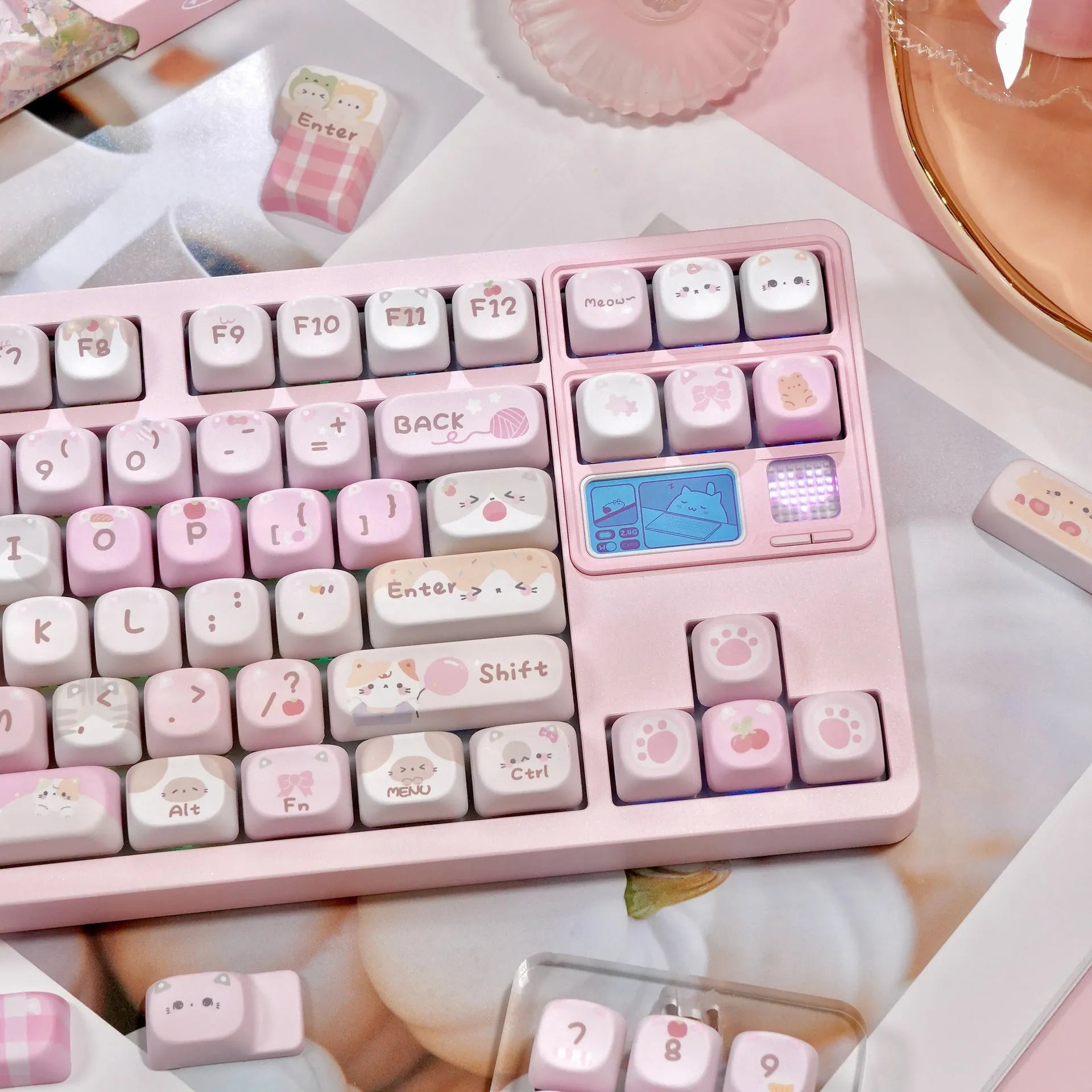 MOA height pink sublimation keyboard keycap set with cartoon design, shown on a keyboard.