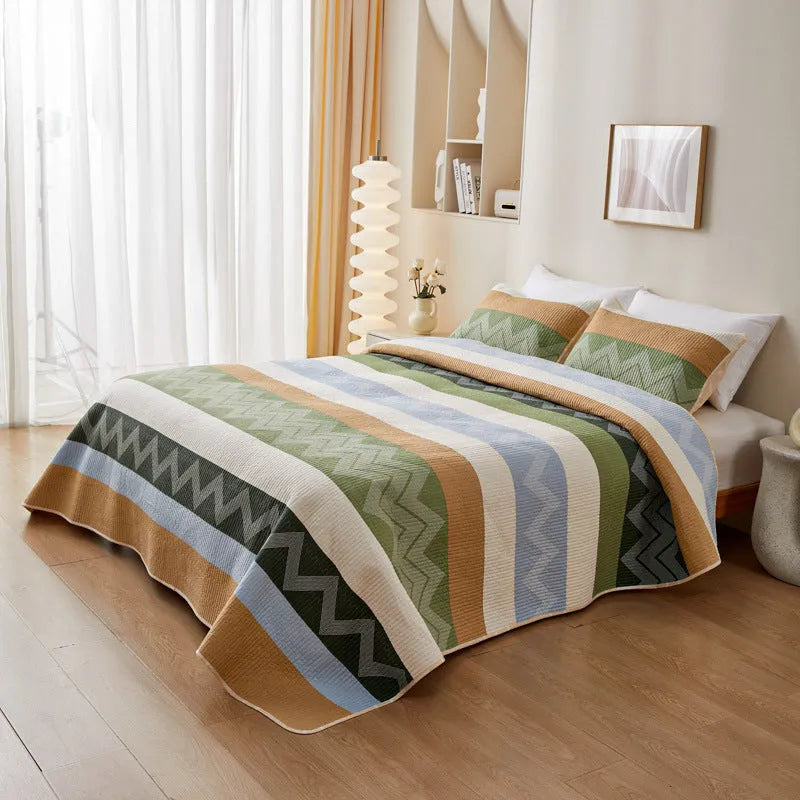 Pure cotton floral printed bed sheet and pillowcases laid flat on a bed.