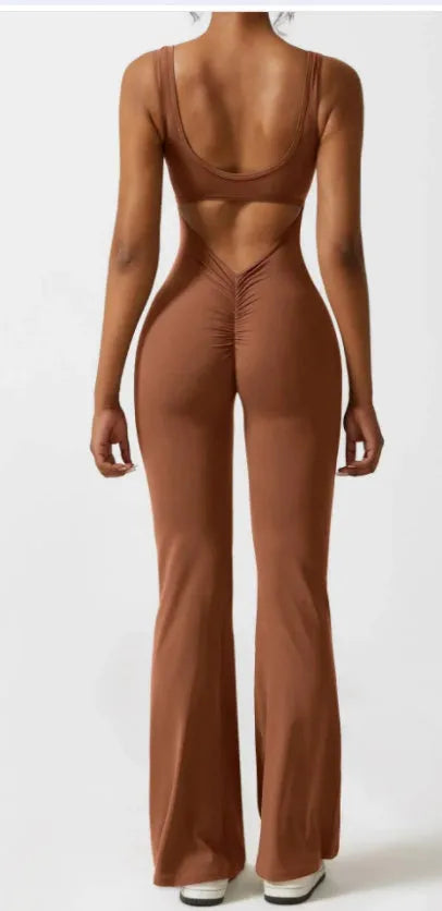 Women's black seamless yoga bodysuit jumpsuit with built-in chest pad and mid waist