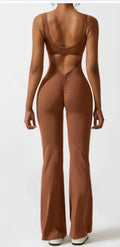 Women's black seamless yoga bodysuit jumpsuit with built-in chest pad and mid waist