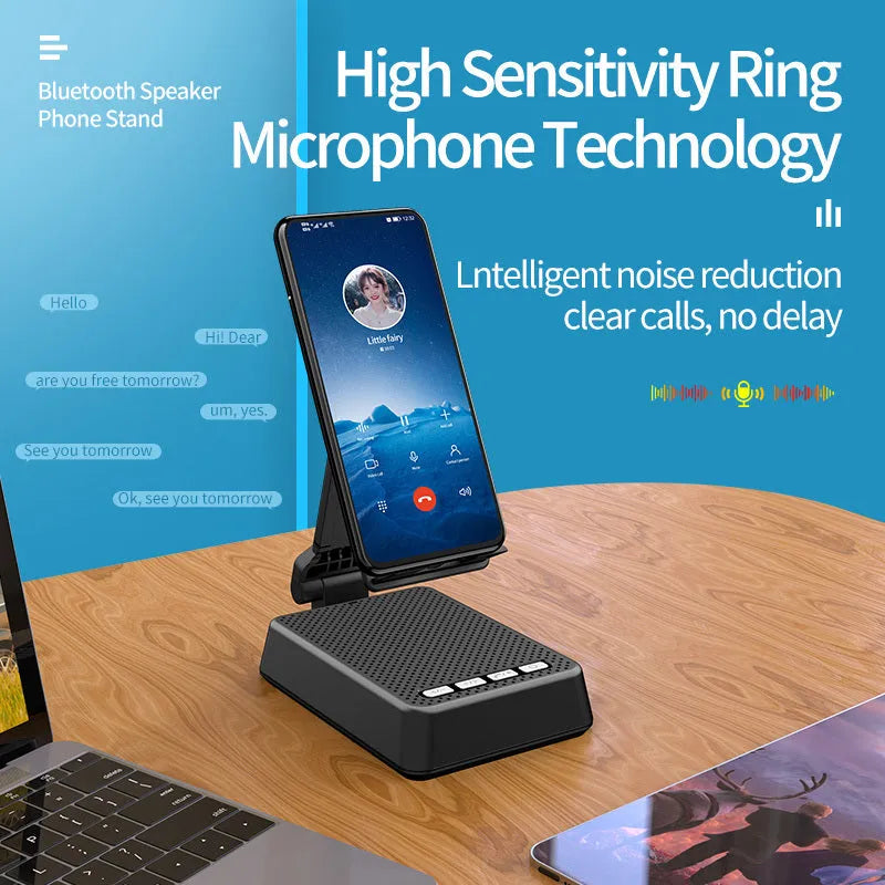 Black mobile phone broadcasting stand with integrated Bluetooth speaker on a desk.