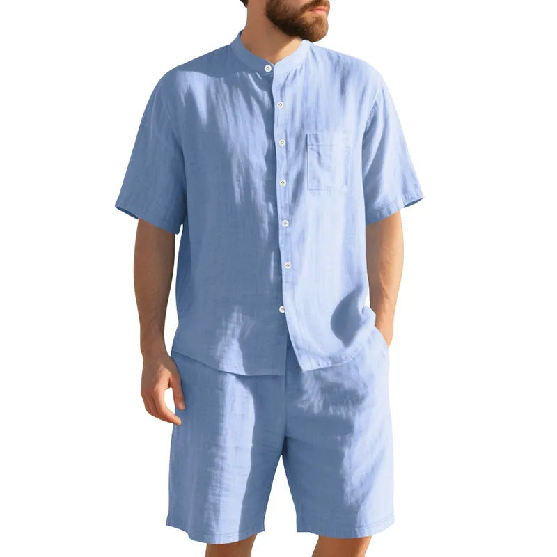 Men's light blue linen blend summer suit with Henry collar shirt-style jacket and matching shorts on a hanger.