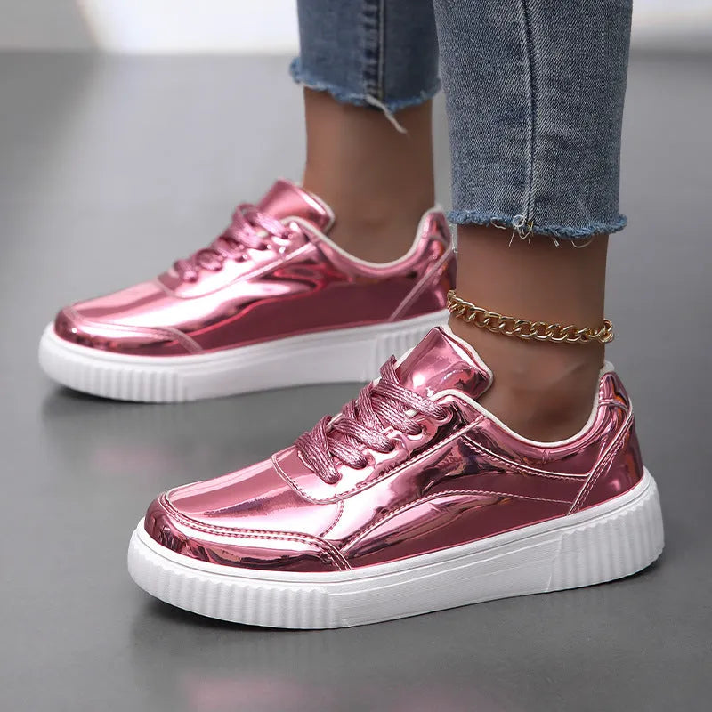 Gold sequinned unisex platform sneaker with thick sole and stitching detail on a white background.
