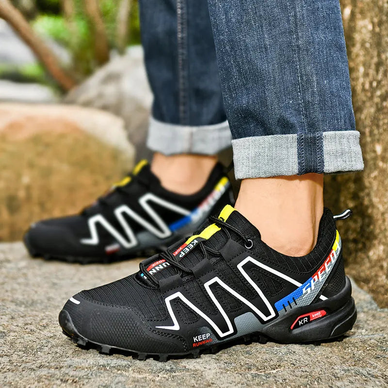 Men's grey-orange plus size casual shoes with synthetic leather upper and rubber sole.