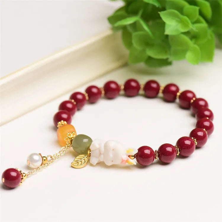 Natural cinnabar bracelet for women in purple-gold sand with rabbit motif, showing 8mm and 10mm bead size options.