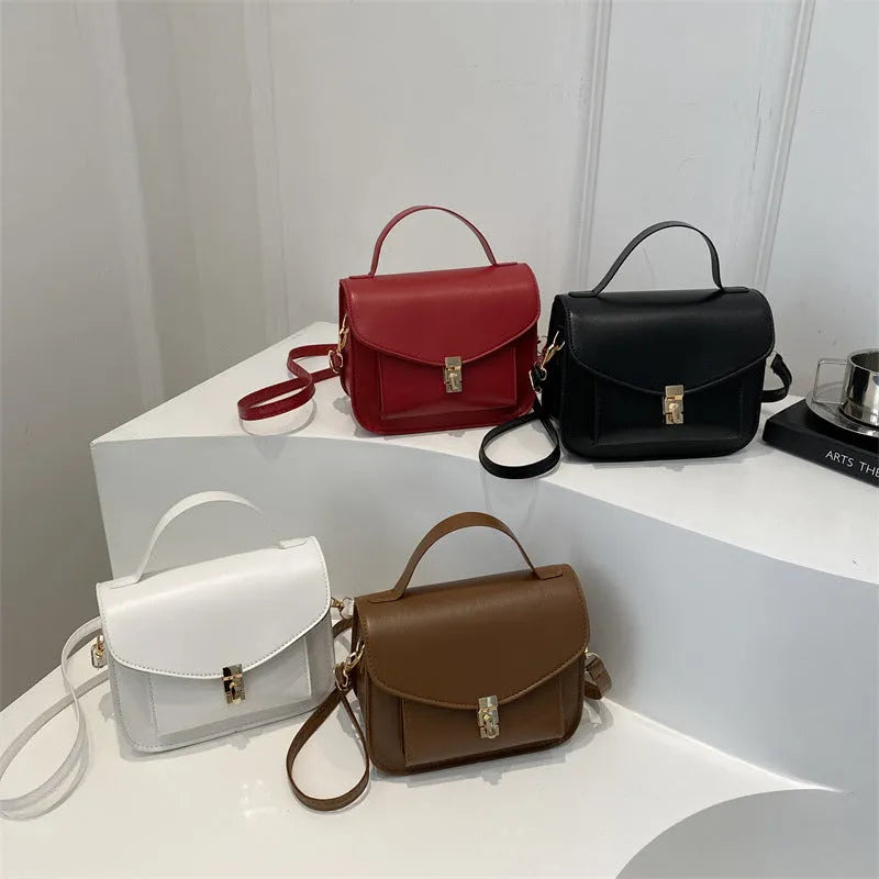Retro style square messenger bag in PU with a crossbody strap and internal document pocket.