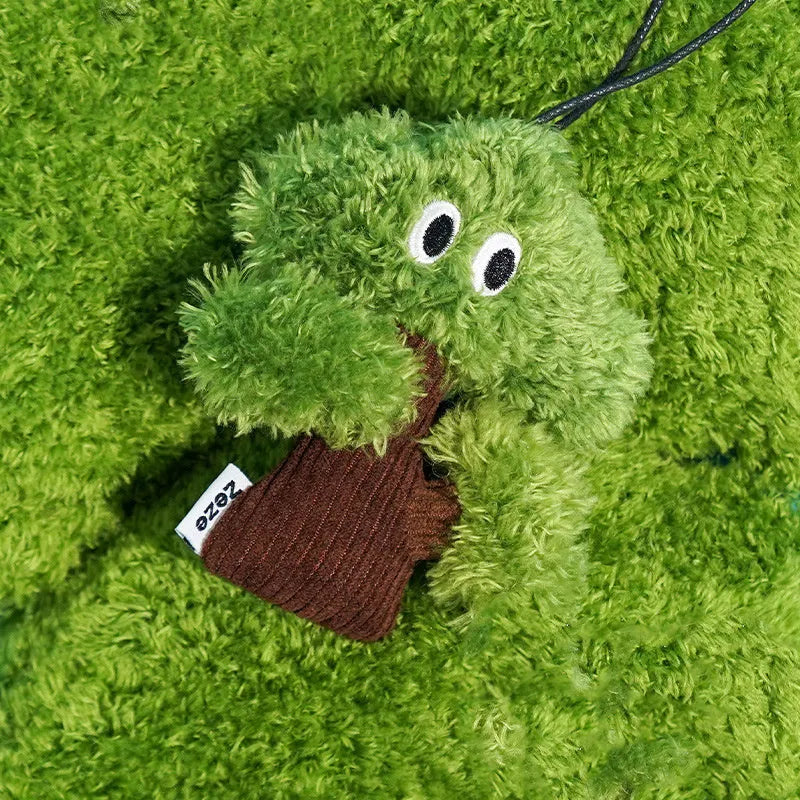Green pine tree-shaped cat chew toy with a hanging loop, shown with size options.