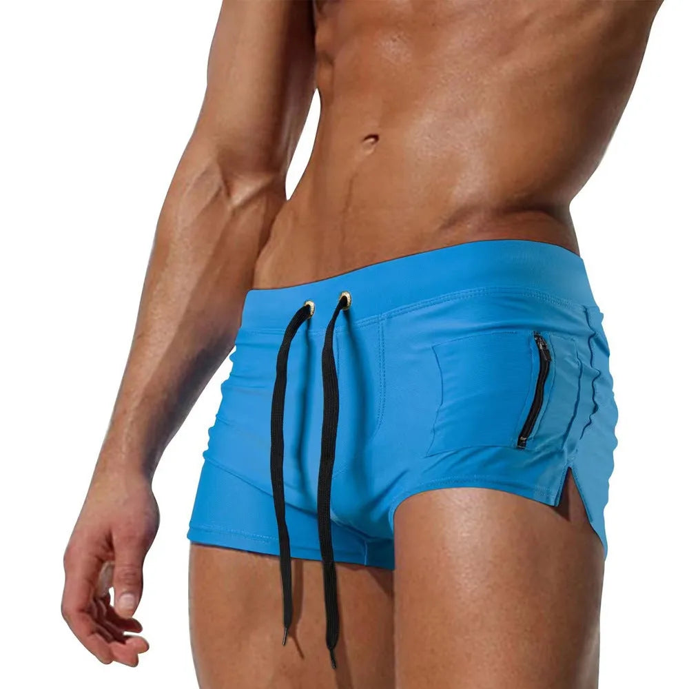 Men's black high-waist swimming trunks with a lace-up front, shown laid flat.