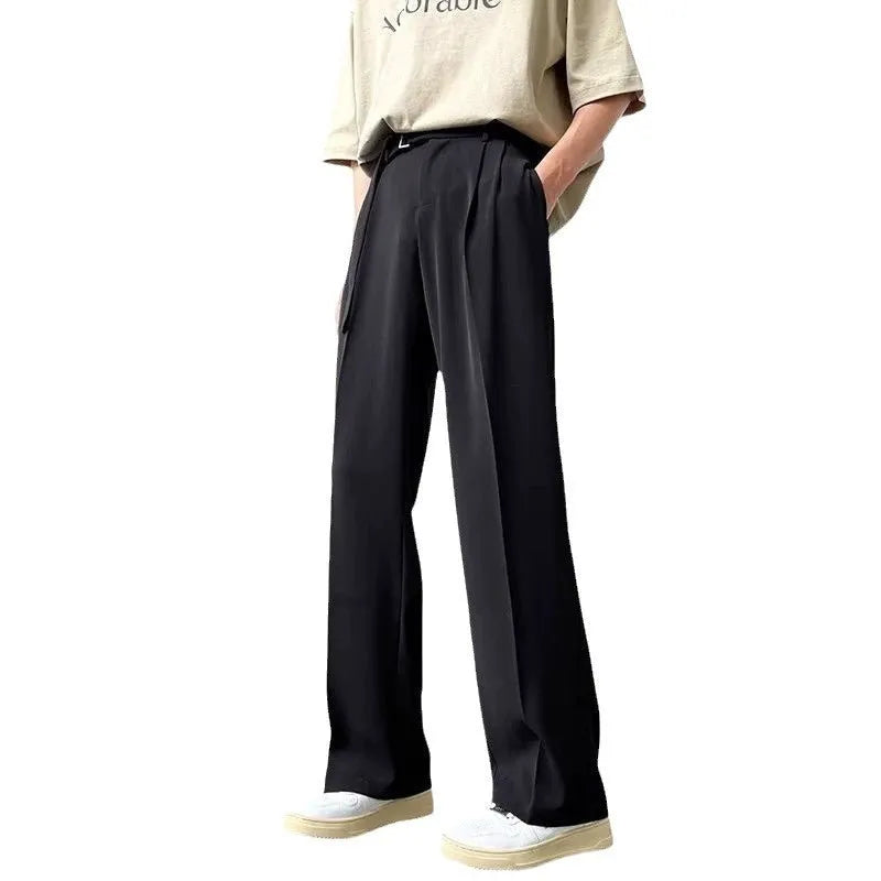 Black straight leg wide trousers with loose fit and non-iron chemical fibre fabric in solid colour.