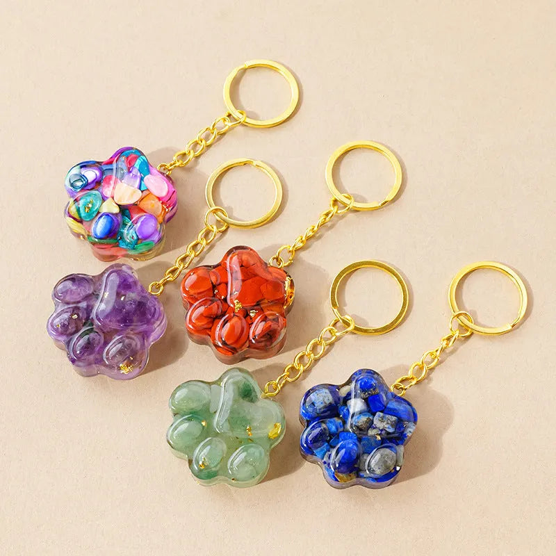 Natural crystal cat's paw keychain pendant in various gemstone colours including pink, red, blue and green crystals