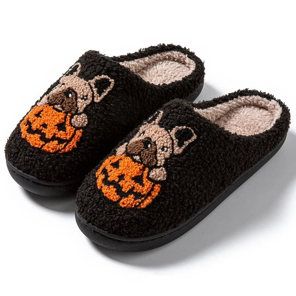 Halloween pumpkin design house slippers with plush cotton upper and TPR rubber sole in black and white.