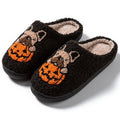 Halloween pumpkin design house slippers with plush cotton upper and TPR rubber sole in black and white.