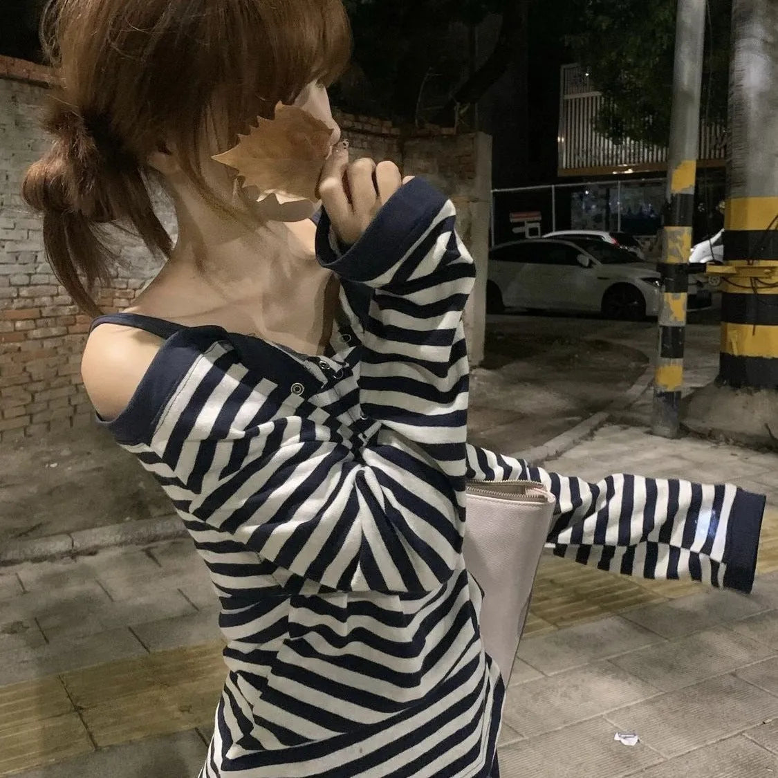 Dark blue Korean-style oversized women's long-sleeve t-shirt with stripe and embroidery detail.