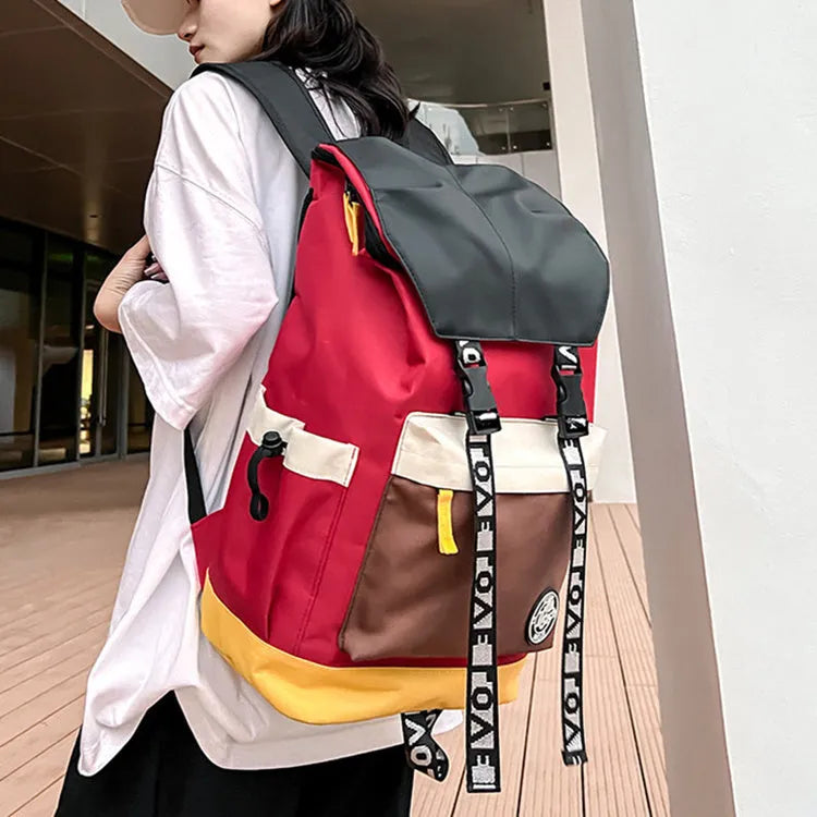 Oxford cloth student backpack shown in black, green, or red with multiple carry straps.