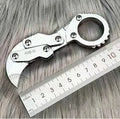 Small stainless steel 420J2 folding knife with 2.6cm blade on table