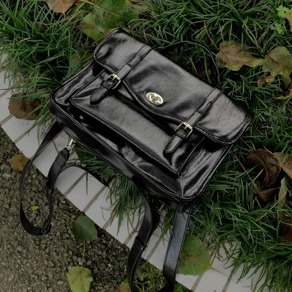 Black college messenger bag with oil wax PU leather finish showing 35cm length dimensions