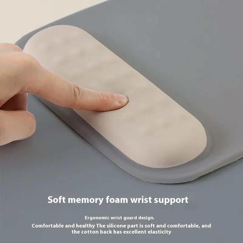 Ergonomic mouse pad with integrated wrist strap on cloth silicone surface