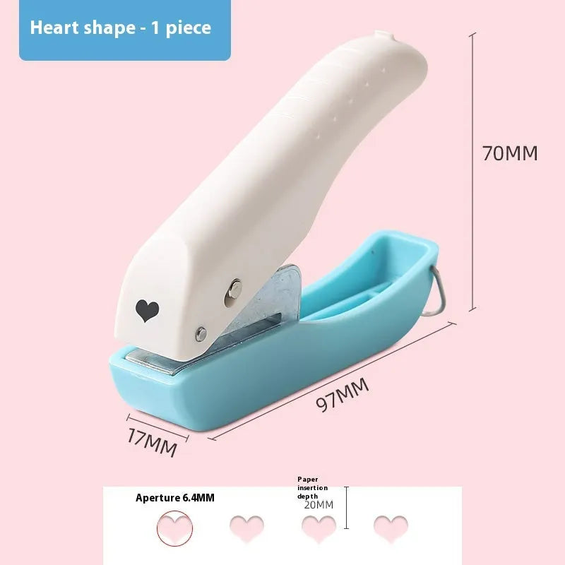 Small manual embossing punching machine with love, star, and round pattern discs for paper crafts.