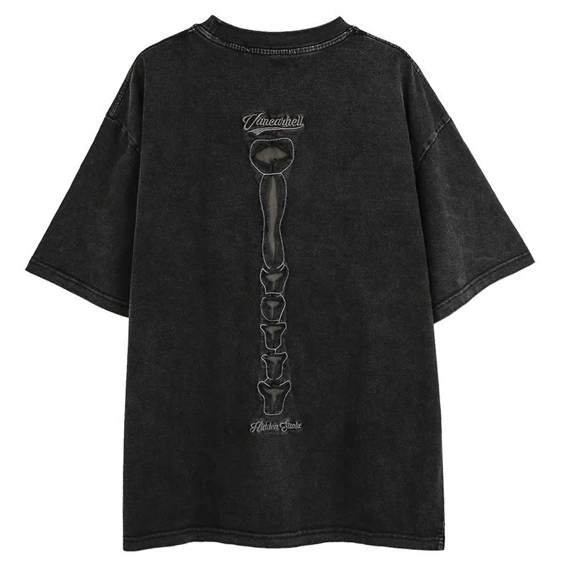 Dark high street style brown t-shirt with large skull graphic print and loose drop-shoulder sleeves.