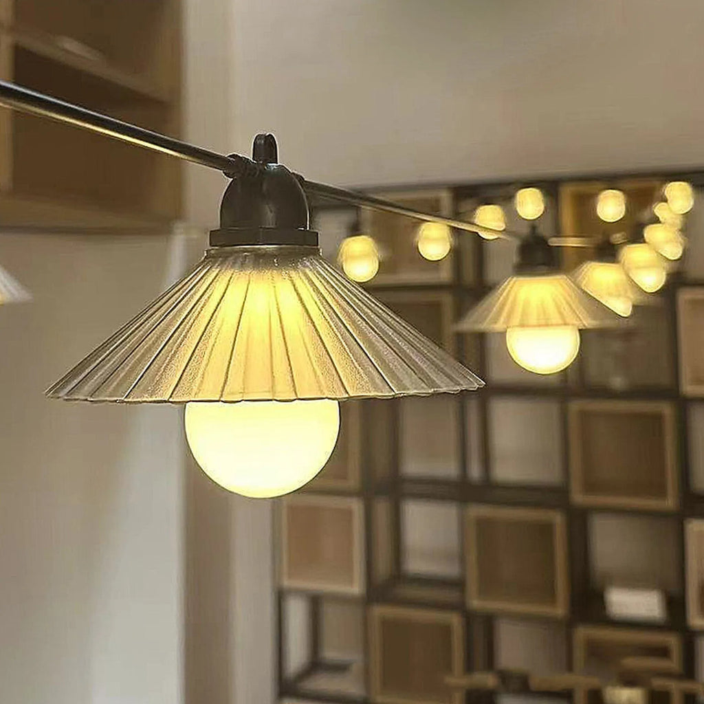 Outdoor LED string lights with flower-shaped globes, showing IP65 waterproof rating and 5V low voltage operation.