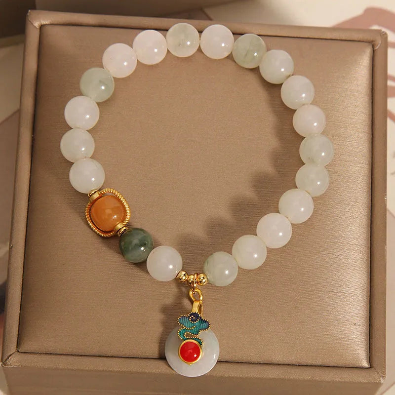 Women's ice jade crystal bracelet with pearl elements and xiangyun peace jade buckle