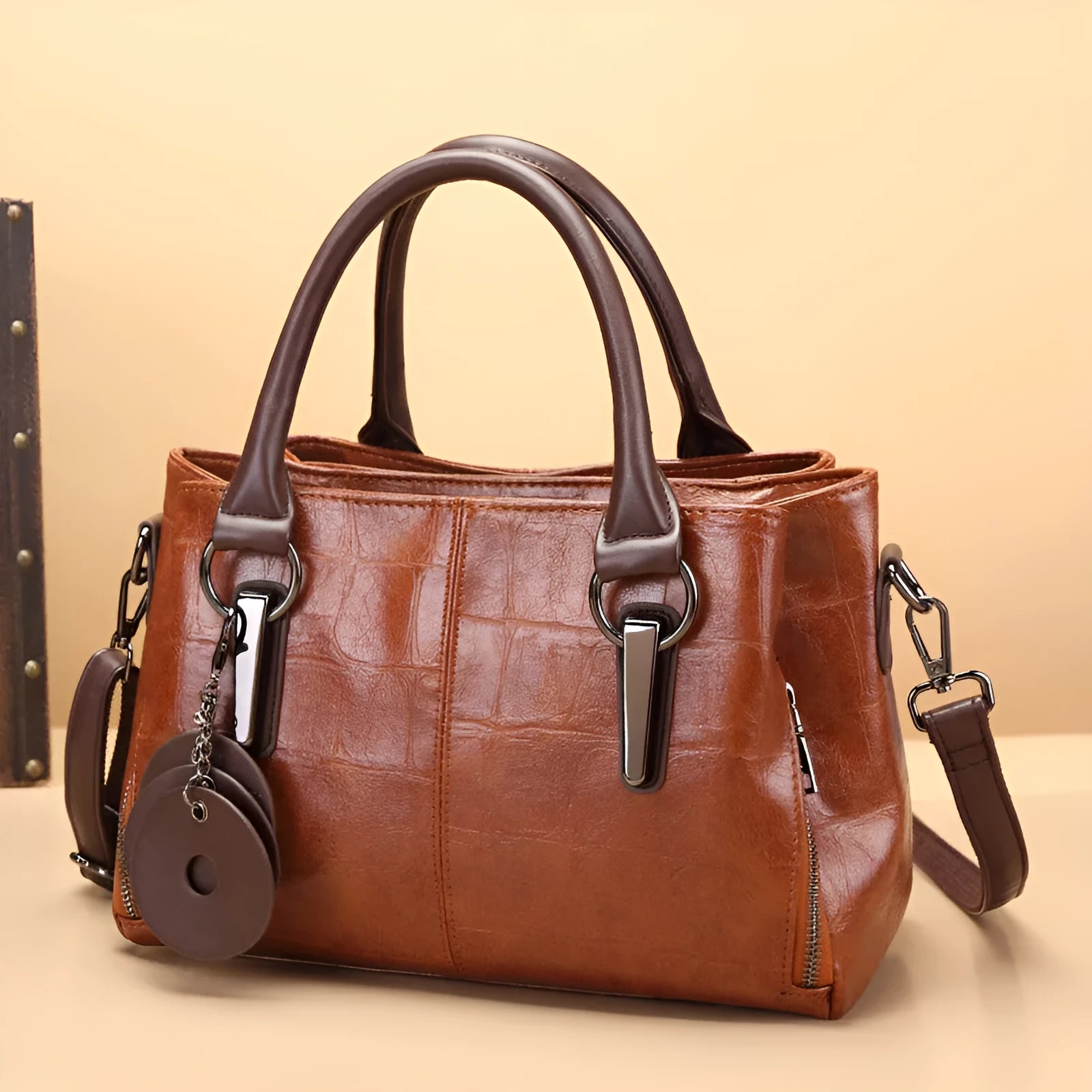 Horizontal square PU leather shoulder bag with contrasting stitching showing internal compartments including mobile phone section